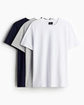 Three plain t-shirts in black, gray, and white on a white background